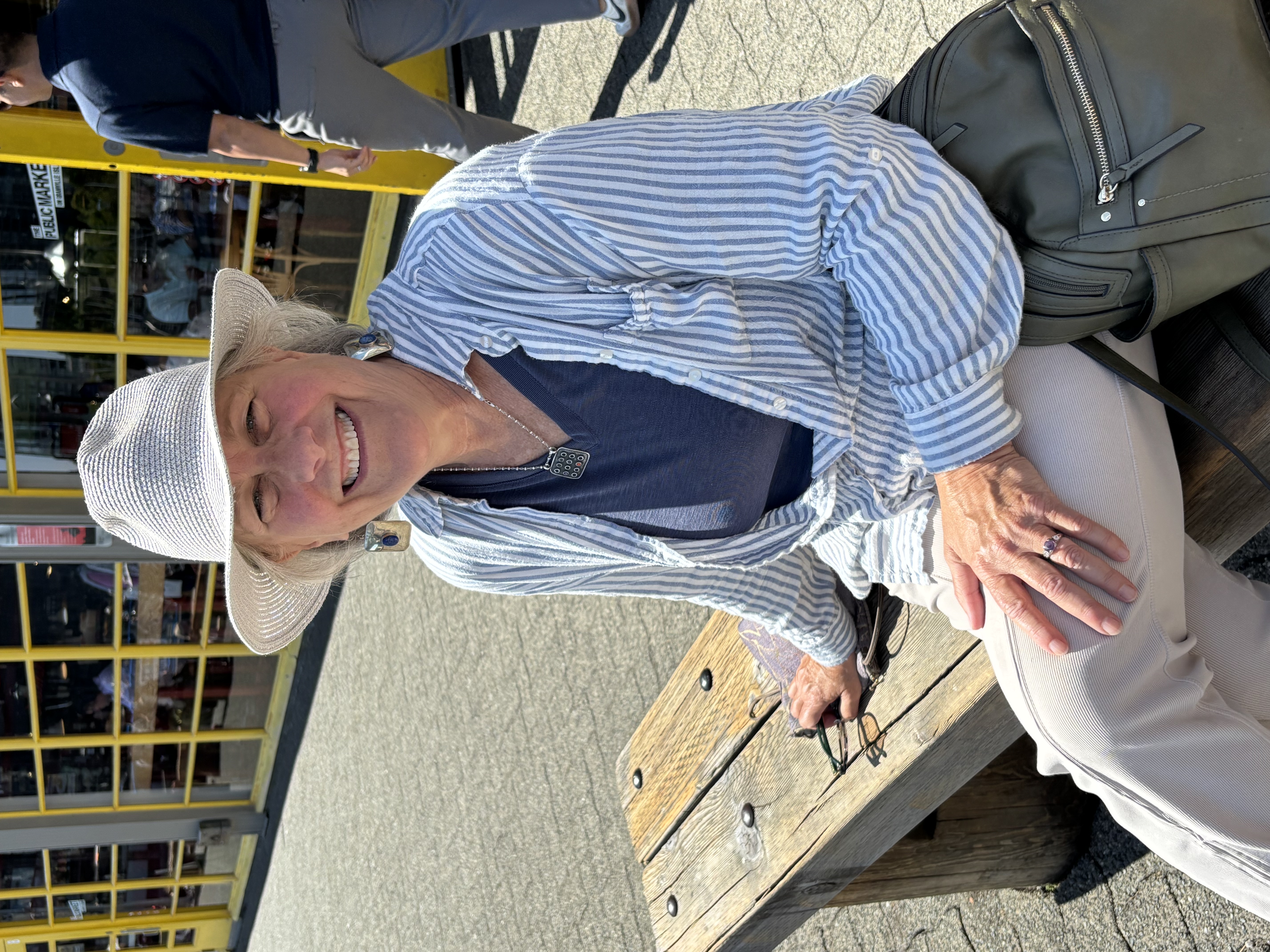 Illana Berger seated on a bench in the sun